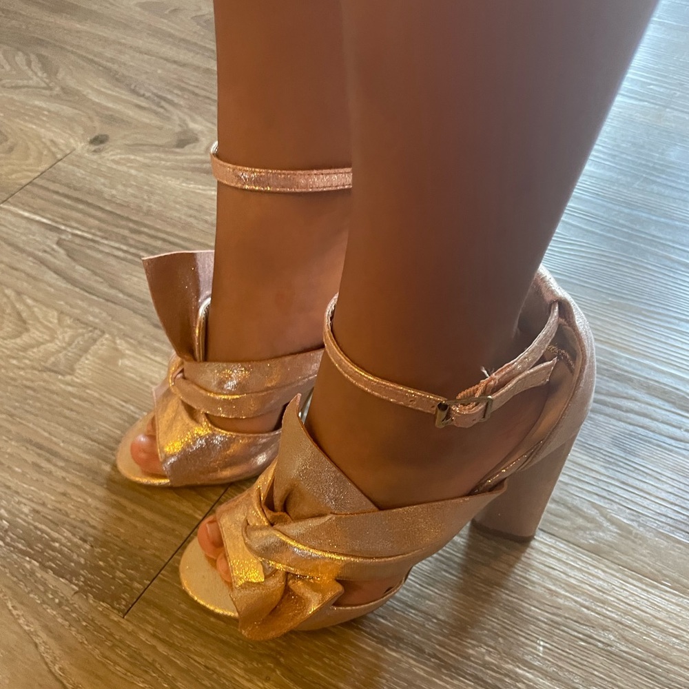 Metallic pink heels with bow